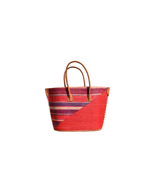 Handmade raffia handbag from Madagascar featuring red, with purple and striped design, finished with leather handles and reinforced corners.