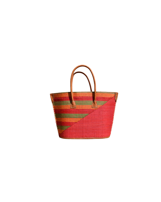 Colorful woven tote bag with leather handles on a white background