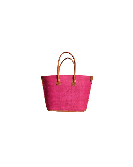 Fushia Pink tote bag with brown leather handles on a white background