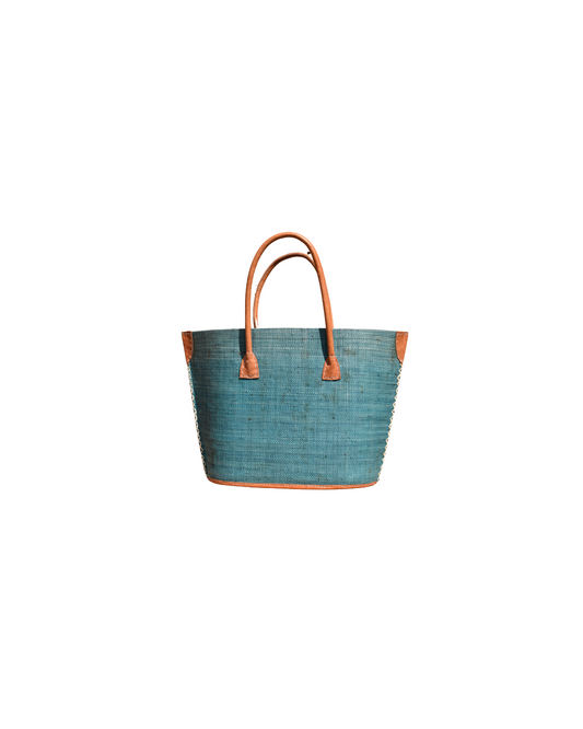 Teel Blue raffia woven tote bag with leather handles on a white background