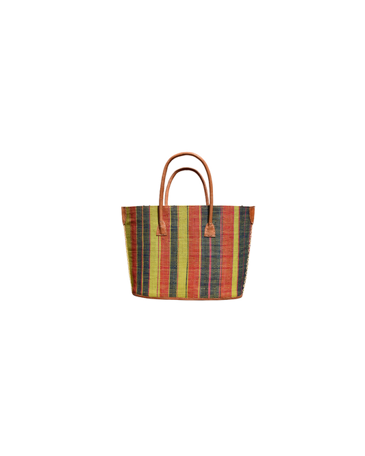 “Handmade medium raffia handbag from Madagascar featuring multicolored vertical stripes in green, yellow, red, and black, finished with leather handles and reinforced corners.”