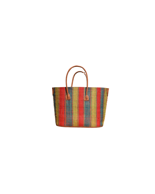 Front View:
“Handmade medium raffia handbag from Madagascar with multicolored vertical stripes in red, yellow, green, and blue, finished with leather handles and reinforced corners.”
