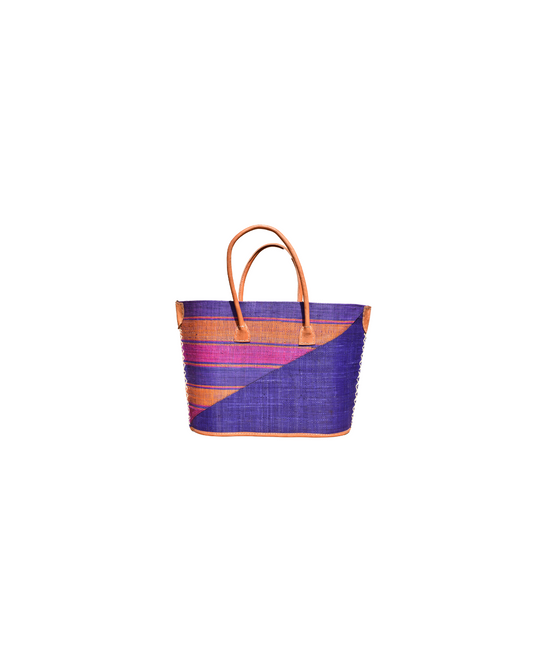 Handmade raffia handbag with diagonal purple and pink panels, orange striping, and leather handles – Beach Bliss 111 front view.