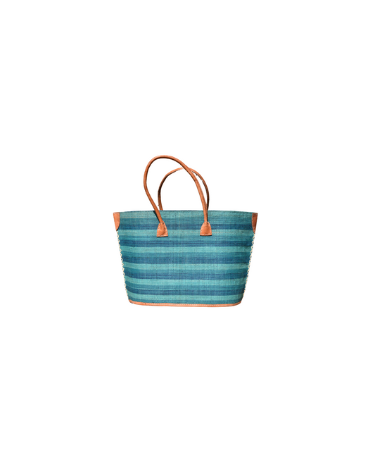 Medium raffia handbag with aqua and teal horizontal stripes, brown leather handles, and reinforced corners – Beach Bliss 132 front view.